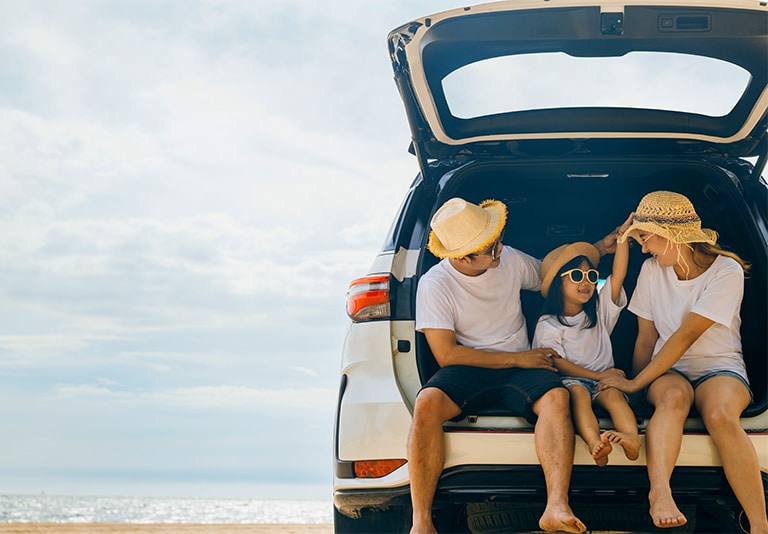 Family enjoying a beach trip with a comfortable SUV rental from Step One Car Rental in Fort Walton Beach, FL